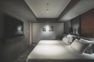 SAPPORO STREAM HOTEL客房内的一张或多张床位