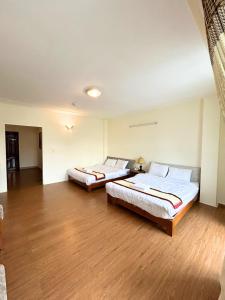 Postel nebo postele na pokoji v ubytování ANH ĐÀO HOTEL
