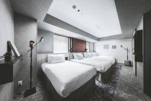 SAPPORO STREAM HOTEL客房内的一张或多张床位