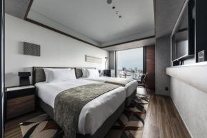 SAPPORO STREAM HOTEL客房内的一张或多张床位