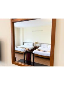 Postel nebo postele na pokoji v ubytování ANH ĐÀO HOTEL
