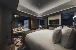 SAPPORO STREAM HOTEL客房内的一张或多张床位