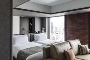 SAPPORO STREAM HOTEL客房内的一张或多张床位