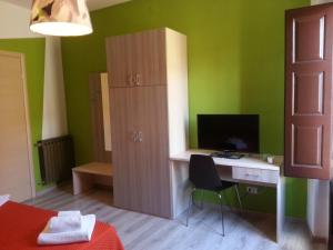 TV a/nebo společenská místnost v ubytování B&B Al Centro