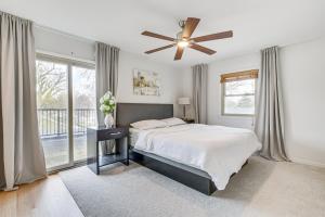 a bedroom with a bed and a ceiling fan at Family-Friendly Villa Park Home 16 Mi to Chicago! in Villa Park