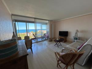 a living room with a view of the ocean at Calme et vue exceptionnelle! in Banyuls-sur-Mer