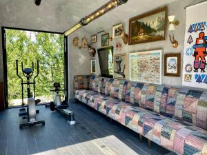 a living room with a couch and a window at Chalet sisimut in Courchevel