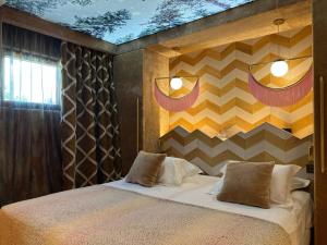 Ένα ή περισσότερα κρεβάτια σε δωμάτιο στο Le chalet Ikamiut