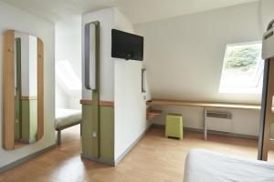 A television and/or entertainment centre at ibis budget Blois Centre