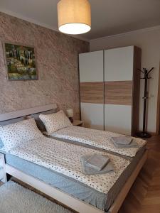 a bedroom with a large bed in a room at Lighthouse 1bedroom GeC apartment 203 in Balchik