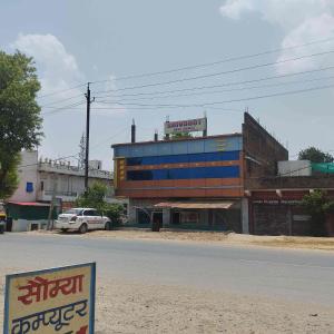 a building on the side of a street with a sign at Shivdoot hotal in Bhind