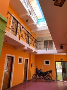 a motorcycle parked in the middle of a building at HOSTAL EL REY in Cafayate