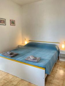 Posteľ alebo postele v izbe v ubytovaní Grazioso Appartamento n 47 a 100mt dal mare