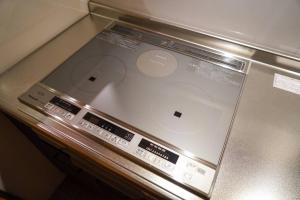 a laptop computer sitting on top of a counter at Nesaki Native in Hakodate