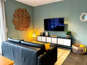 TV a/nebo společenská místnost v ubytování LITELIVING Cozy Suite