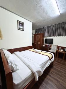 Postel nebo postele na pokoji v ubytování ANH ĐÀO HOTEL