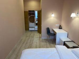Postel nebo postele na pokoji v ubytování Kyiv Central Apart Hotel