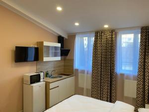 Kuchyň nebo kuchyňský kout v ubytování Kyiv Central Apart Hotel
