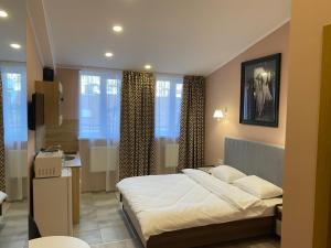 Postel nebo postele na pokoji v ubytování Kyiv Central Apart Hotel