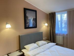 Postel nebo postele na pokoji v ubytování Kyiv Central Apart Hotel