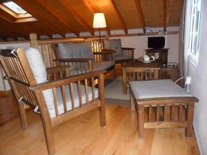 a living room with wooden chairs and a table at Casa Pepe El Segador - VV-1054-AS in San Juan de la Arena