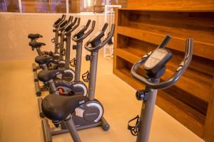 a row of exercise bikes lined up in a gym at FUSION in Brasilia