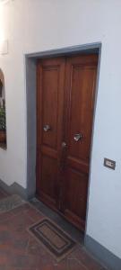 a wooden door in a corner of a room at Hotel Medici in Florence