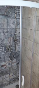 a shower with a glass door in a bathroom at Hotel Medici in Florence