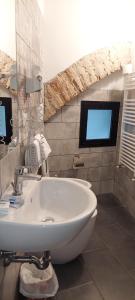 a bathroom with a sink and a tv in a room at Hotel Medici in Florence