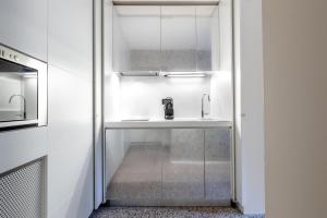 a kitchen with a sink and a microwave at Venice Suite San Marco 213 in Venice