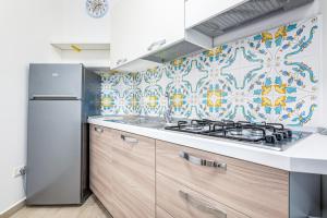 Η κουζίνα ή μικρή κουζίνα στο Agio Apartments Diamante - Trilocale Standard