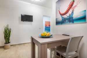 Μια τηλεόραση ή/και κέντρο ψυχαγωγίας στο Agio Apartments Diamante - Trilocale Standard