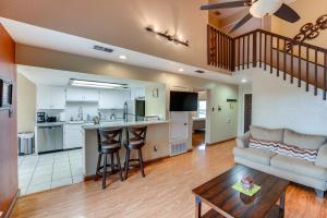 a living room with a couch and a table at Boat Slip Access North Padre Island Condo! in Padre Island