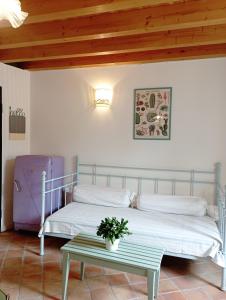 a bedroom with two beds and a table at La Piazzetta 2 in Iseo +18 photos