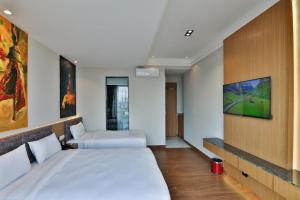 Letto o letti in una camera di Lakhey Hotel