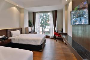 Letto o letti in una camera di Lakhey Hotel