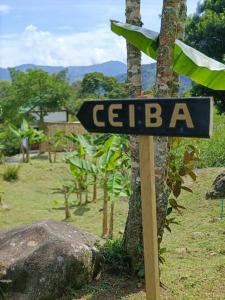 a sign that says cebaba next to a tree at Refugio Cabaña San Carlos Antioquía C in San Carlos