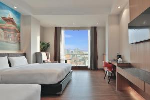 Letto o letti in una camera di Lakhey Hotel