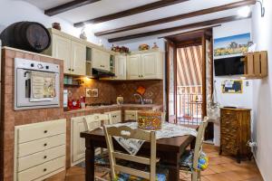 Η κουζίνα ή μικρή κουζίνα στο CarMa Apartment