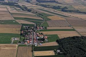 an aerial view of a village in a field at Ferienwohnung Gut-Wattberg in Hofgeismar