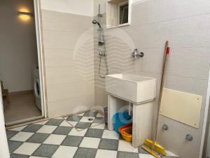 a bathroom with a sink and a tiled floor at Casa Mireya - Spiaggia a 50m - by Cala Salento in Porto Cesareo