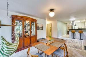 a living room with a wooden table and chairs at Lake Access & Hot Tub: Pet-Friendly Arnold Home in Arnold