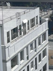 an overhead view of a white building with windows at Top Floor, Sleeps 4, Queen Mary, Ocean, City Views in Long Beach