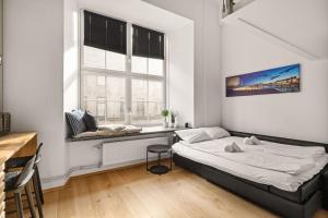 Un pat sau paturi într-o cameră la Dinbnb Apartments I 500m to Oslo Central Station I Roof Terrace I Free Gym