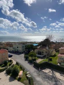 an aerial view of a town with the ocean at Alvor Torralta Apartment in Alvor