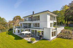 an aerial view of a white house at Villa Relaxotic Apartments in Glücksburg