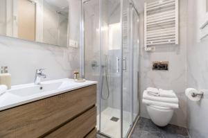 a bathroom with a shower and a toilet and a sink at Paschalis House central best stay in Athens