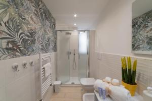 a bathroom with a shower and a toilet at Stone House Michelle in Torre Annunziata +27 photos
