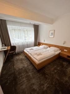 Giường trong phòng chung tại Pension Baranekhof - accommodation in nature - Baranek Resorts