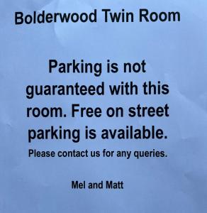 a sign that reads parking is not guaranteed with this room at Hotel 50 in Bournemouth